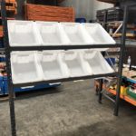 Longspan shelving set up angled shelves and plastic tubs inserted for picking from