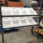 Longspan shelving set up angled shelves and plastic tubs inserted for picking from
