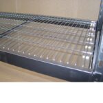 image shows how the mesh decks sit flush in the stepped beams of the longspan shelving